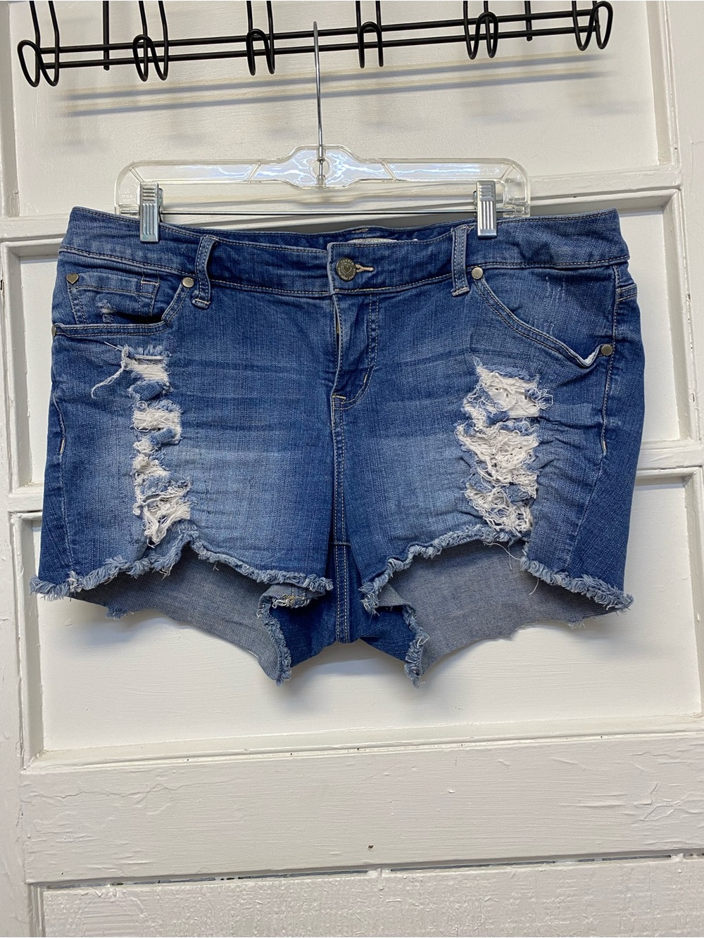 Torrid distressed denim shorts with a raw hem women’s size 16